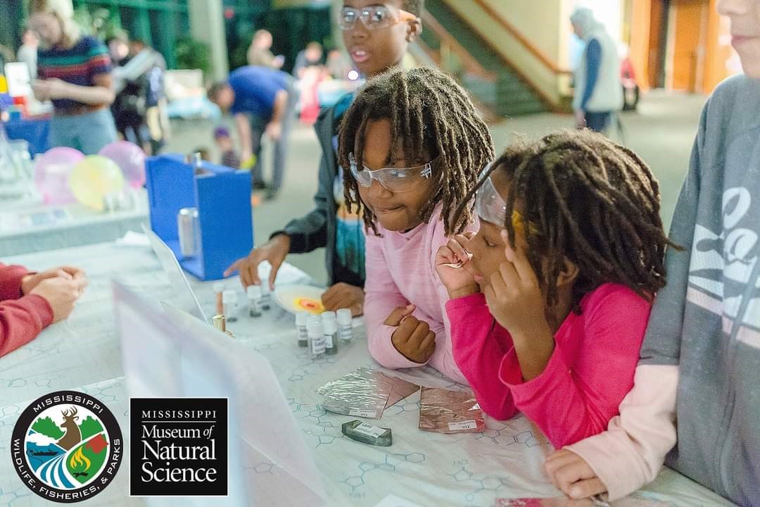 Students doing an experiment at the Science Makers event