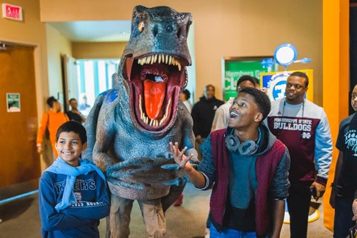 Children delighted by statue of Blue the Utah Raptor