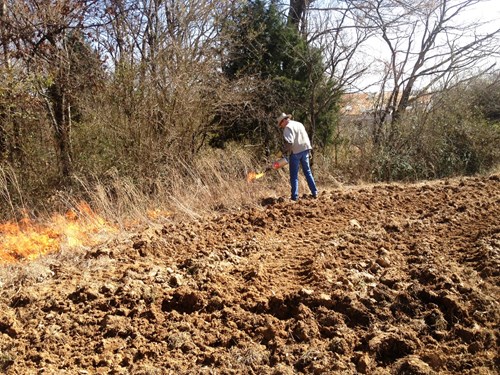 Landowner tests prescribed burning equipment during a Fire on the Forty workshop