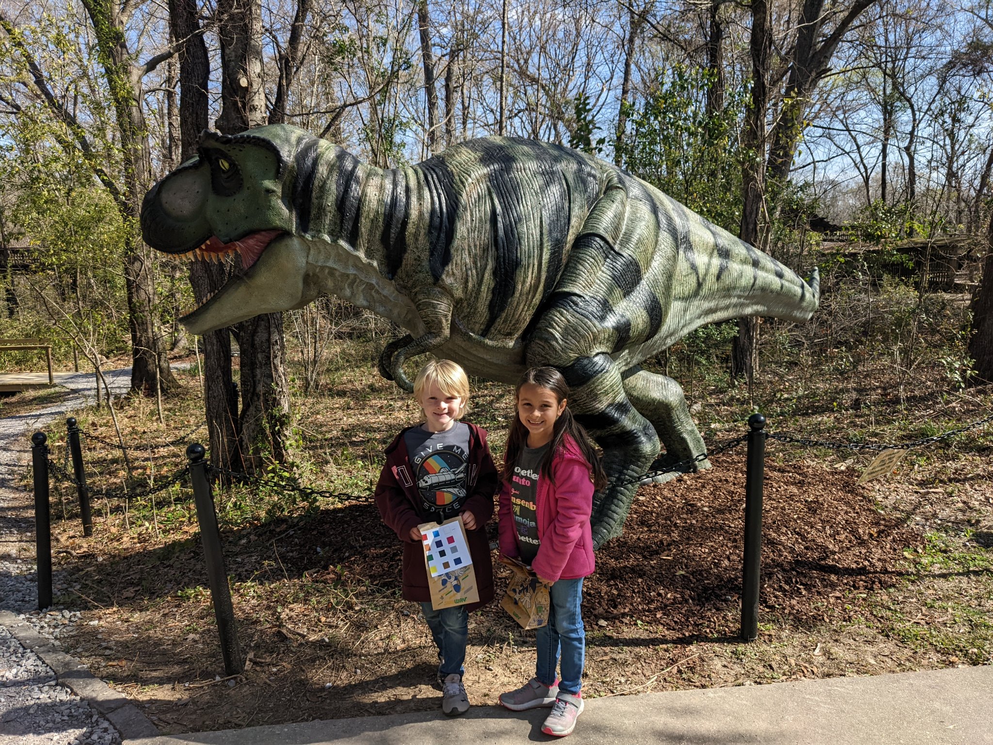 mmns spring break camp children in front of dinosaur