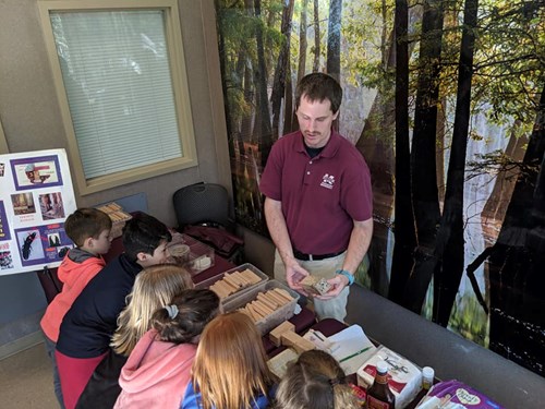 STEM, Leaves, and Trees Event - Group of students at exhibitor table