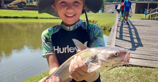 mmns summer camp child with fish