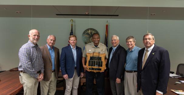 Commissioners with Andre and Canadian bear trap award