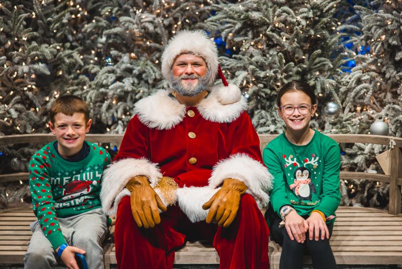 Snow Much Fun Santa with children