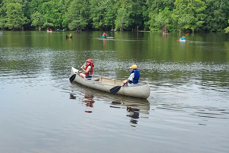 mmns summer campers smiling on canoe