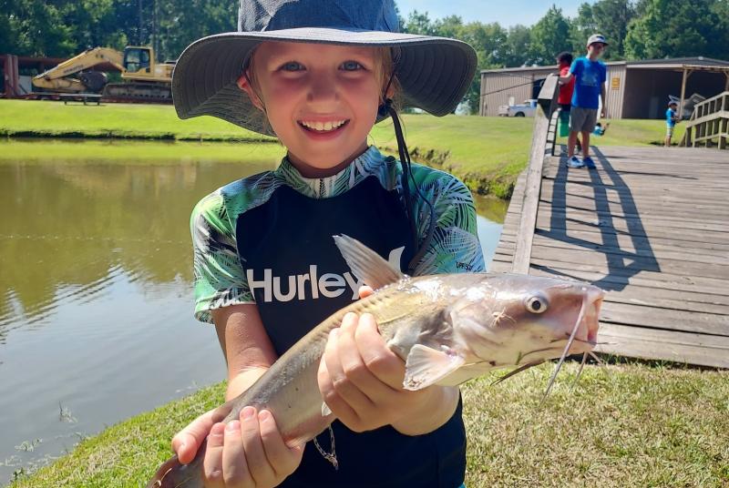 mmns summer camp child with fish