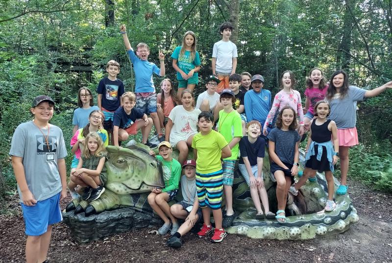 mmns summer campers on a dinosaur